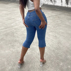Women's high-waisted, three-quarter length stretch jeans with destroyed inserts and side seam slit Fashion Glam