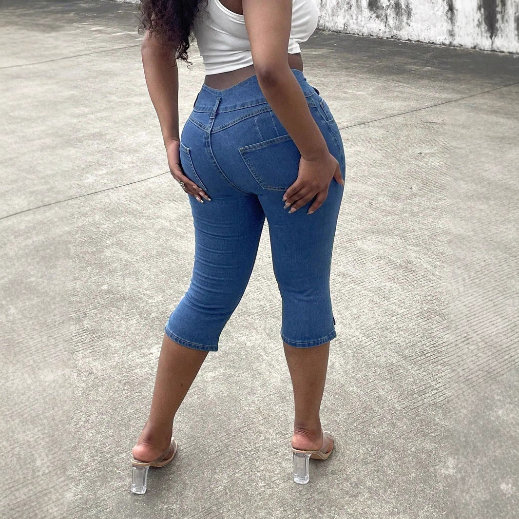 Women's high-waisted, three-quarter length stretch jeans with destroyed inserts and side seam slit Fashion Glam