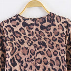 Women’s leopard print mini dress with round neckline, long sleeves, and A-line silhouette Fashion Glam