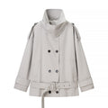 Women's short trench-style jacket with high standing collar, double-breasted front and waist belt Fashion Glam