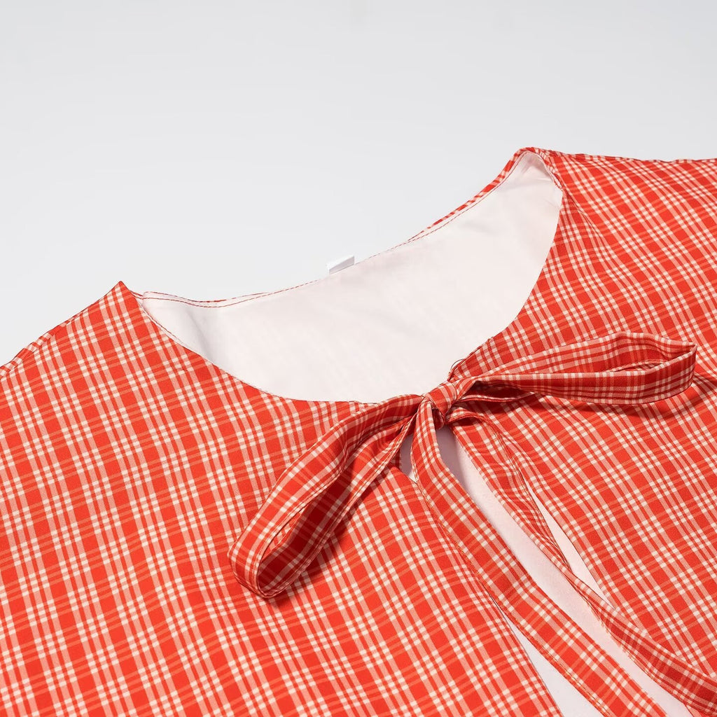 Ladies short cape jacket with check print and decorative tie bow Fashion Glam
