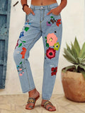 Ladies straight-cut jeans with colorful floral appliqués and light destruction details Fashion Glam