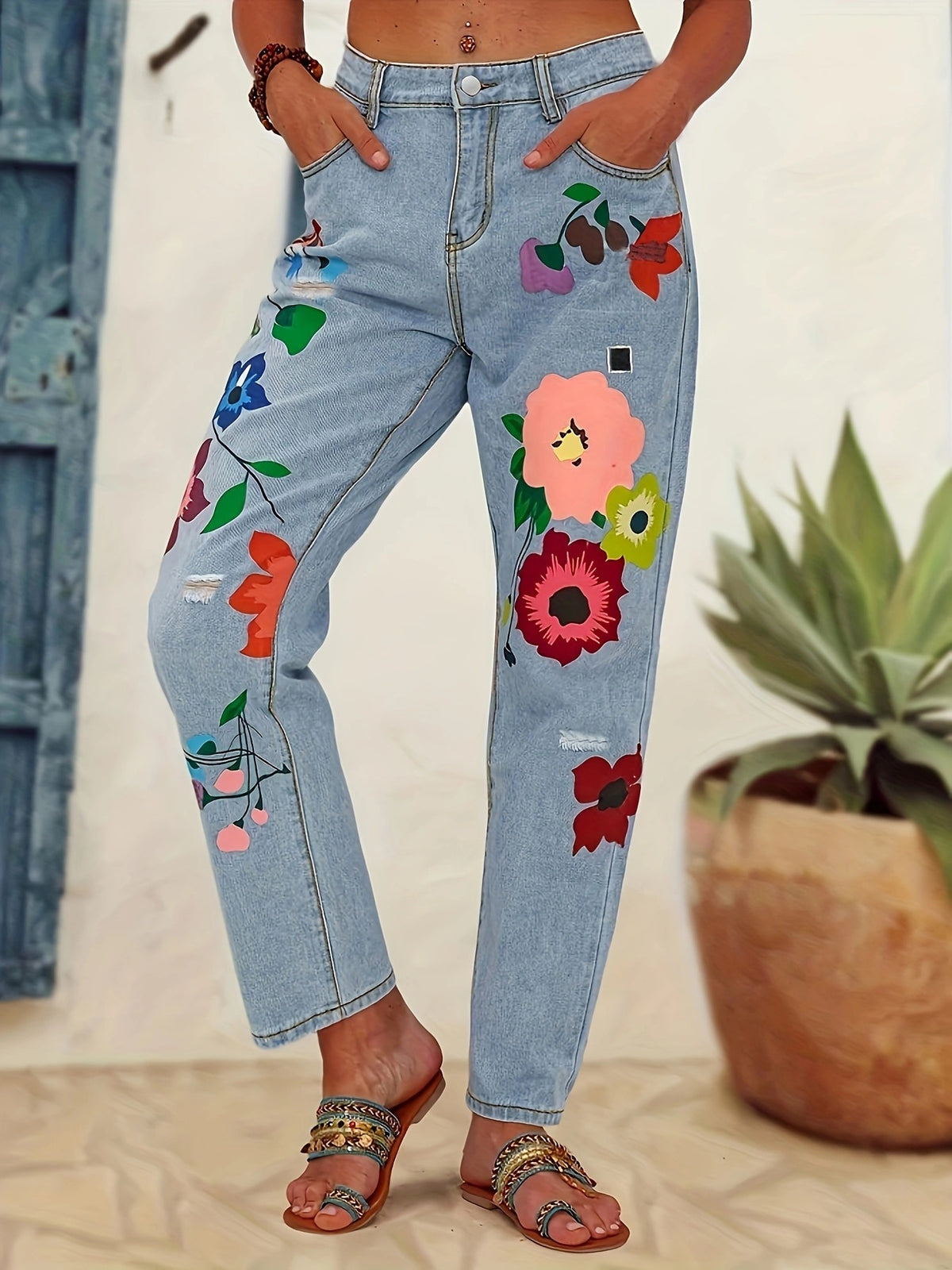 Ladies straight-cut jeans with colorful floral appliqués and light destruction details Fashion Glam
