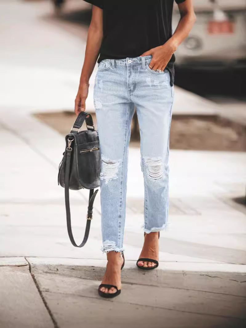 Women's Ripped Denim Jeans with Casual Cut and Frayed Hem Fashion Glam