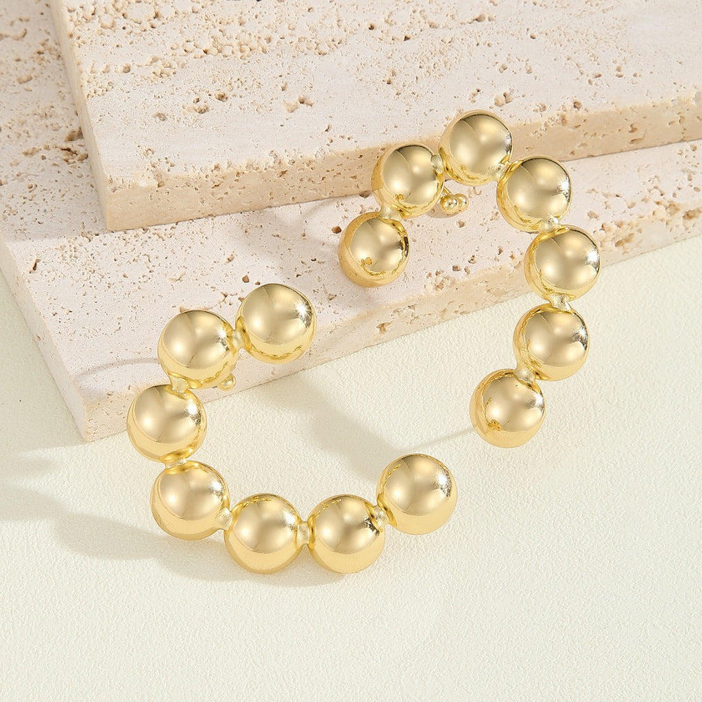 Women's bracelet with structured, golden beads Fashion Glam
