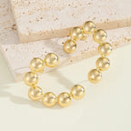 Women's bracelet with structured, golden beads Fashion Glam