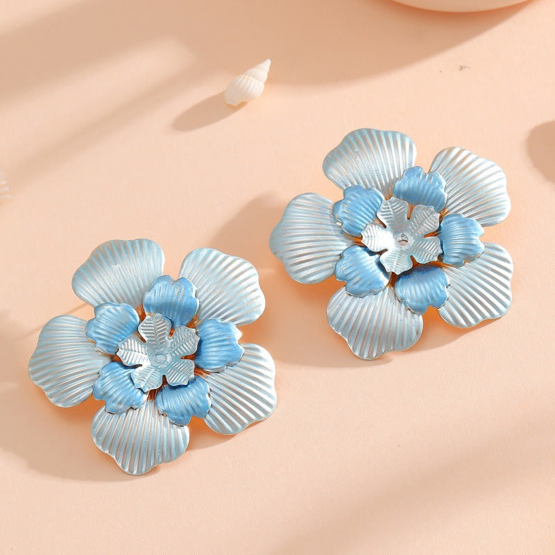 Ladies' flower earrings with intricate design and glossy accents Fashion Glam