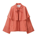 Ladies short cape jacket with check print and decorative tie bow Fashion Glam
