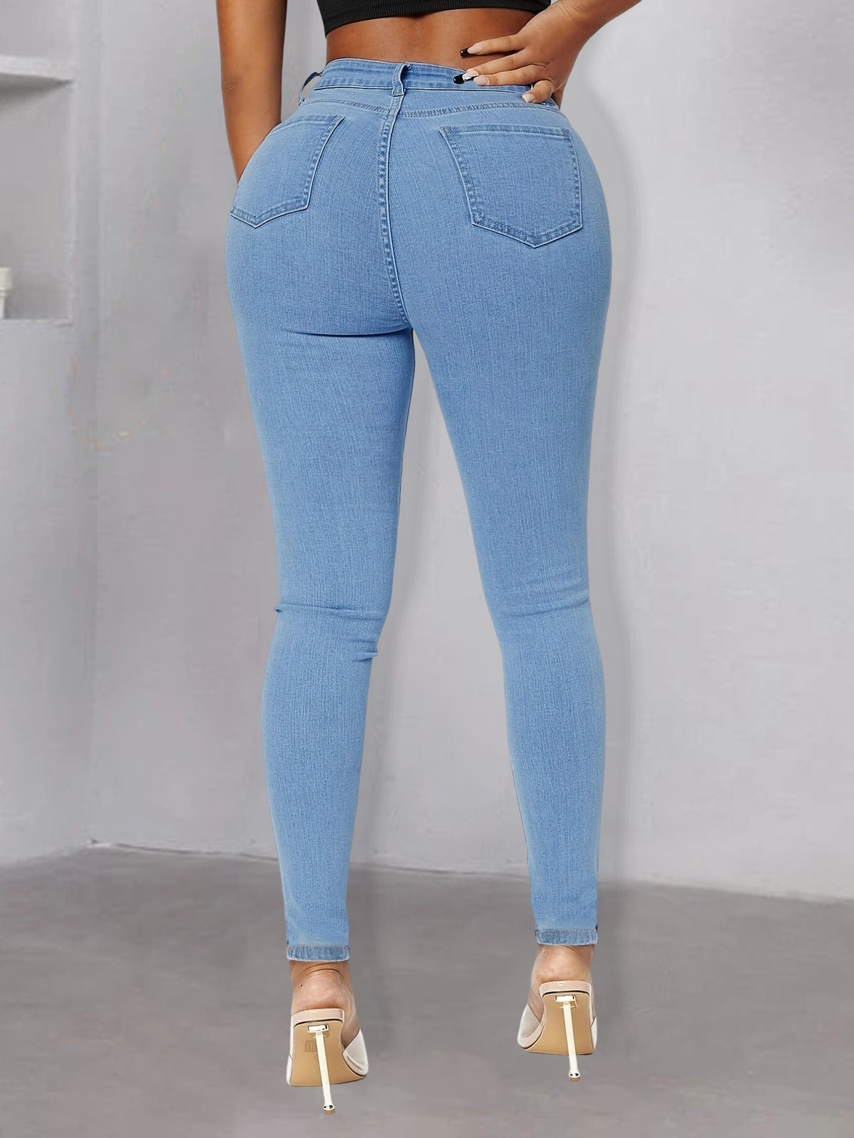 Women pearl-embellished high-waist skinny jeans with knee cutouts Fashion Glam