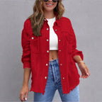 Women's oversized denim shirt jacket with fringe trim, flap pockets, and snap front Fashion Glam
