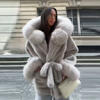 Ladies short coat made of luxurious faux fur with quilted inner lining, hood collar and waist belt Fashion Glam