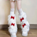 Ladies cozy boot cuffs made of faux fur with bow appliqué and pompons Fashion Glam