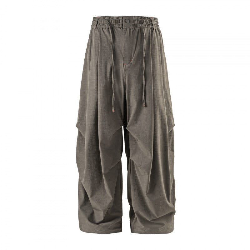 Unisex Loose-fitting technical cargo pants with elastic waistband, drawstring, and zip pockets Fashion Glam