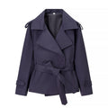 Women's short trench coat with double-breasted button placket, waist belt, and shoulder straps Fashion Glam