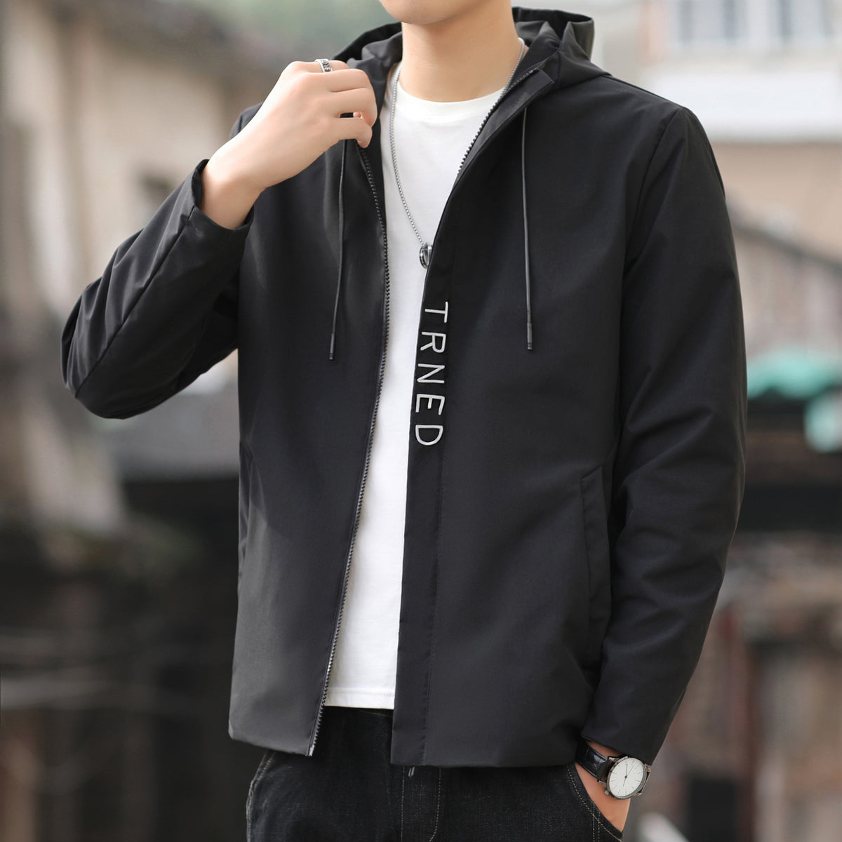 Men's lightweight hooded shell jacket with concealed zipper and minimalist utility look Fashion Glam
