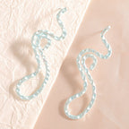 Ladies earrings in elegant wave pattern Fashion Glam