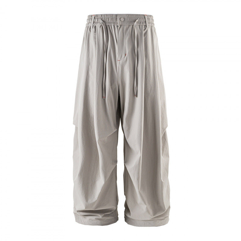 Unisex Loose-fitting technical cargo pants with elastic waistband, drawstring, and zip pockets Fashion Glam