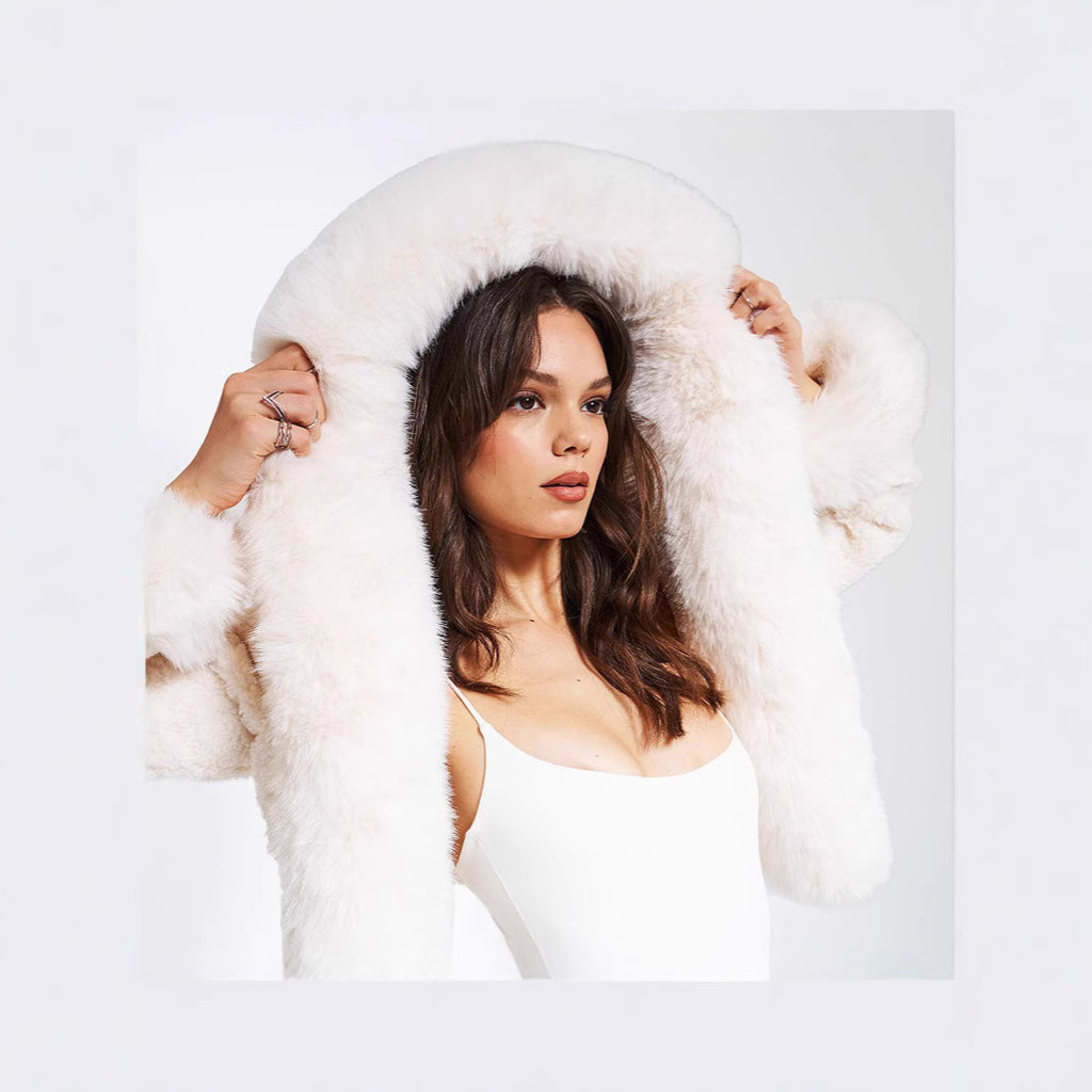 Women's short bolero made of bouclé faux fur with voluminous hood and fur cuffs Fashion Glam