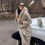 Women's hooded coat made of faux fur with a waist belt and extra soft teddy finish Fashion Glam