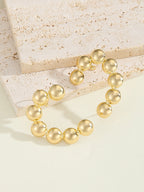 Women's bracelet with structured, golden beads Fashion Glam