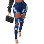 Ladies high-waisted skinny jeans with XXL knee cutouts, heavily distressed used look and sculpting cut Fashion Glam