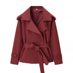 Women's short trench coat with double-breasted button placket, waist belt, and shoulder straps Fashion Glam
