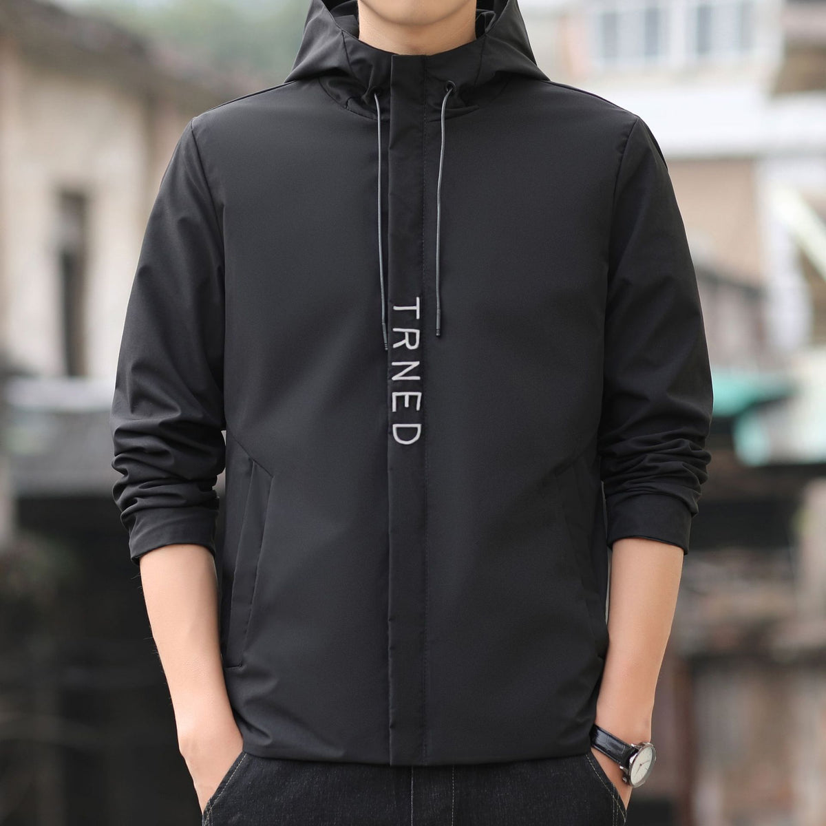 Men's lightweight hooded shell jacket with concealed zipper and minimalist utility look Fashion Glam