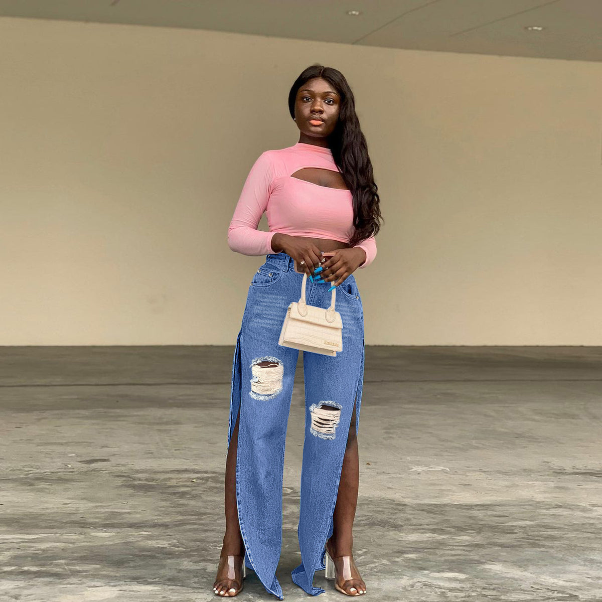Ladies tapered denim jeans with high side slits and destroyed knee area Fashion Glam