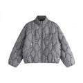 Unisex short cut quilted jacket in boxy cut with diamond quilting and diagonal zip pockets Fashion Glam