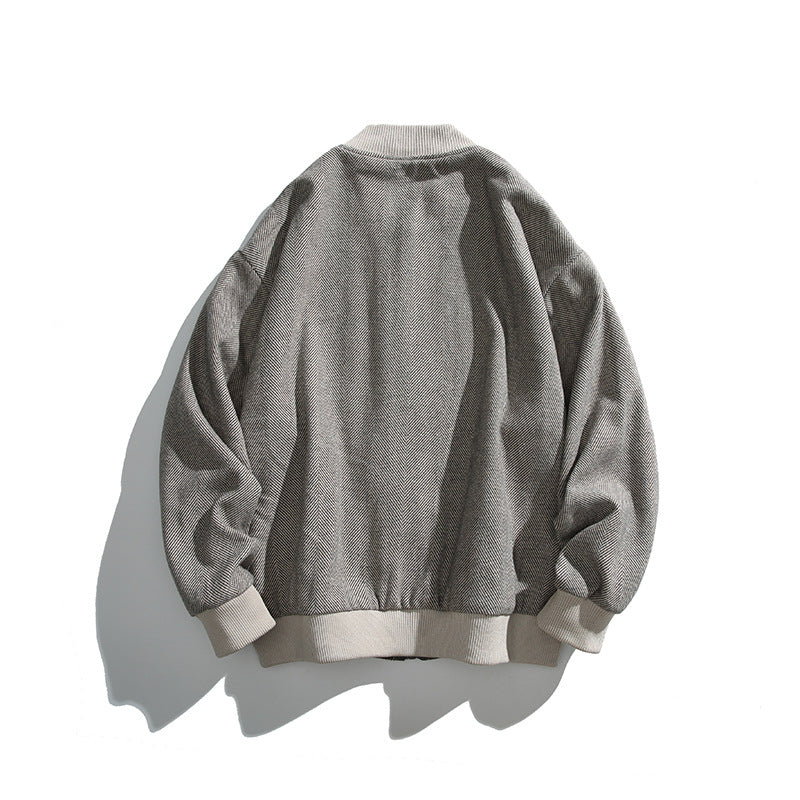 Unisex boxy bomber jacket in herringbone look with ribbed cuffs, flap pockets, and concealed snap button placket Fashion Glam