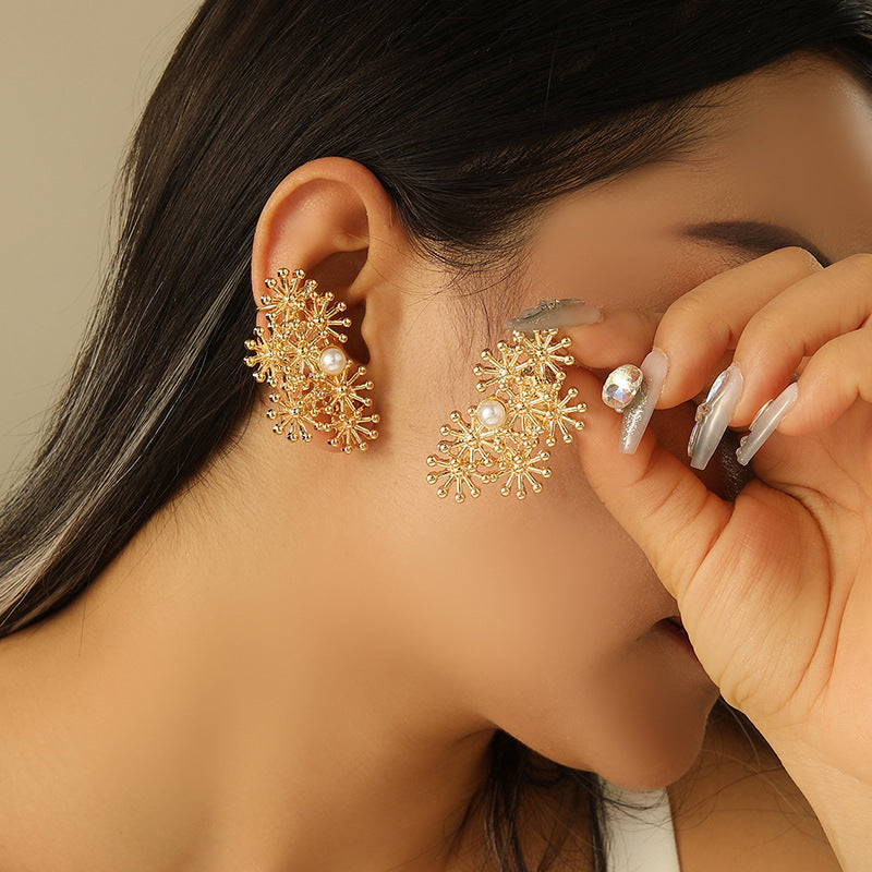 Women’s ear clips with elaborate flower design and pearl accent Fashion Glam