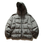 Unisex Oversize quilted jacket in boxy cut with hood and adjustable hem Fashion Glam