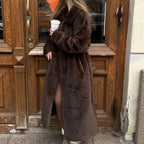 Women's elegant long pile faux fur coat with hood and tailored silhouette Fashion Glam