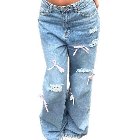 Women High-Waist Baggy Jeans with Vintage Wash, Rips and Pink Bow Applications Fashion Glam