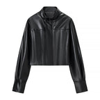 Women's short jacket in biker-bomber style made of vegan leather with a stand-up collar and oversized sleeves Fashion Glam