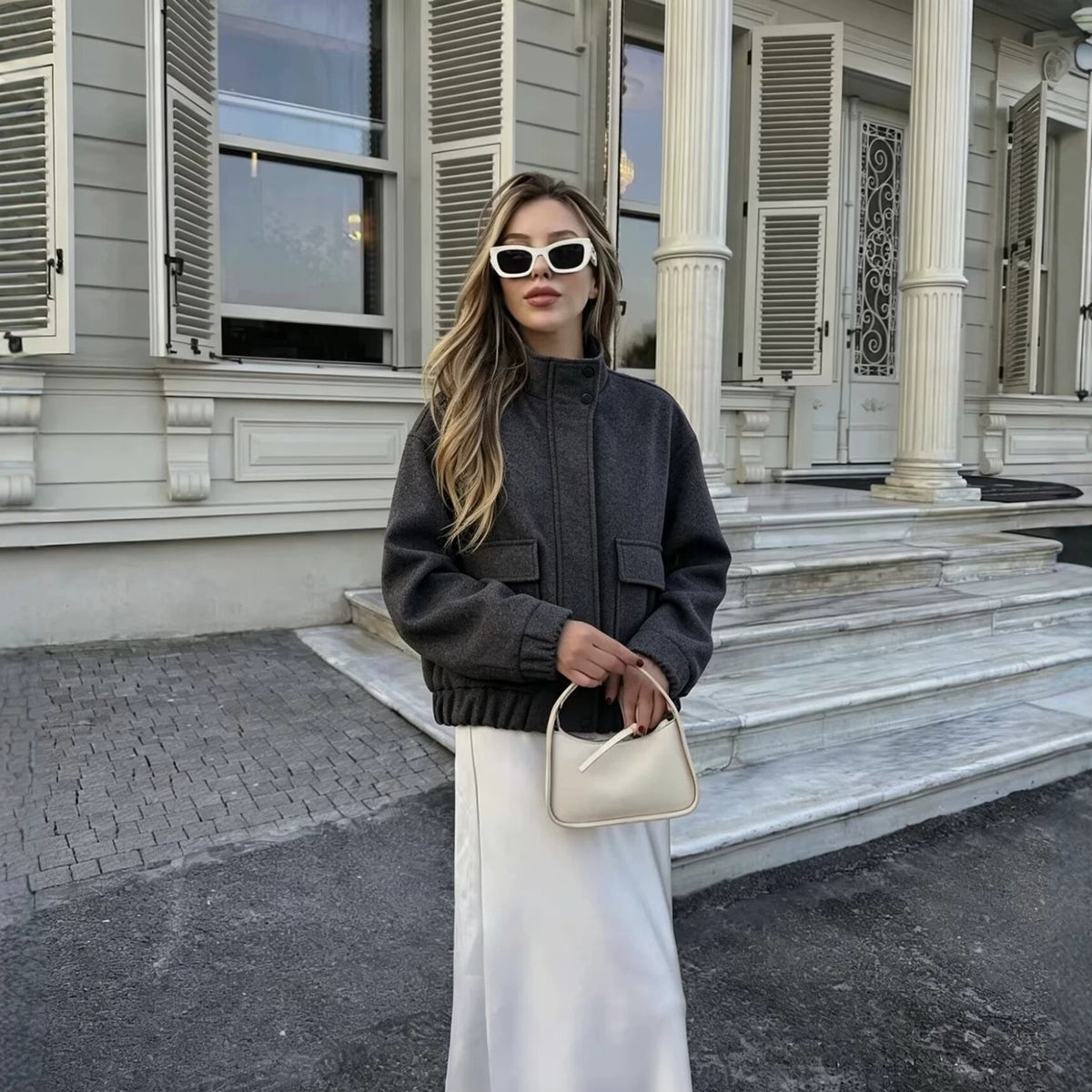 Women's wool blend blouson jacket with stand-up collar, large flap pockets, and elastic hem Fashion Glam