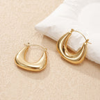 Ladies earrings in a modern, curved design Fashion Glam