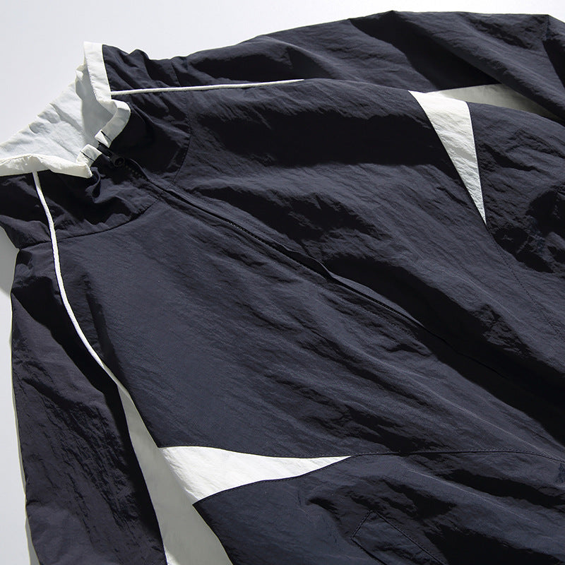Unisex Lightweight Boxy Hooded Jacket in Windbreaker Style with Contrast Panels and Raglan Sleeves Fashion Glam