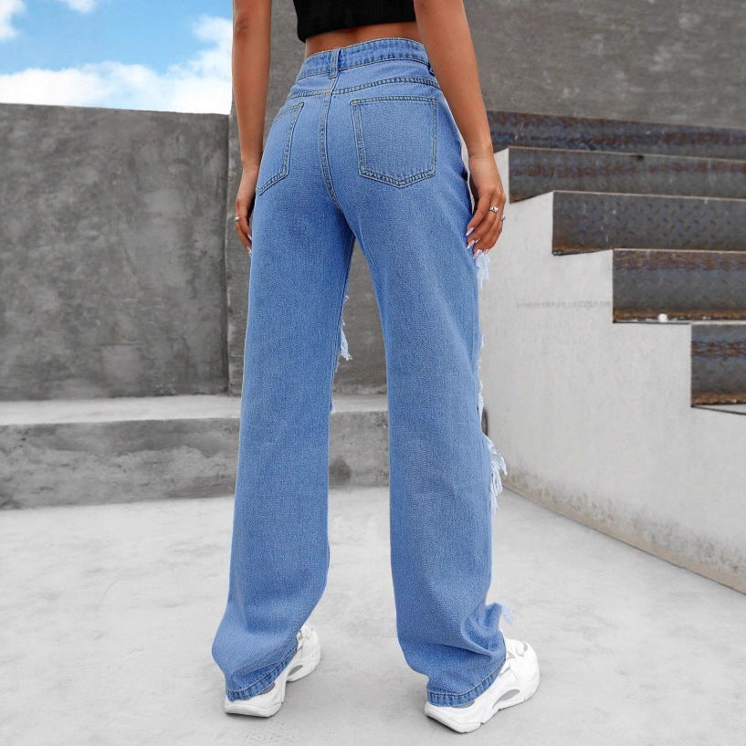 Women heavily distressed flared jeans with wide legs and ripped inserts Fashion Glam