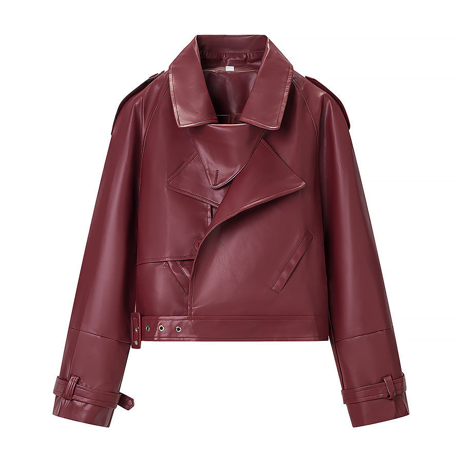 Ladies short cut biker jacket made of faux leather with asymmetrical front and waist belt Fashion Glam