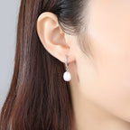 Ladies earrings with elegant zirconia decorations and pearl pendants Fashion Glam