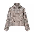 Ladies short jacket in houndstooth with stand-up collar, double-breasted and waist details Fashion Glam