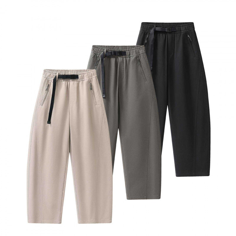 Unisex wide ankle-length cargo pants in relaxed fit with elastic drawstring waistband and zip pockets Fashion Glam