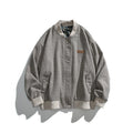 Unisex boxy bomber jacket in herringbone look with ribbed cuffs, flap pockets, and concealed snap button placket Fashion Glam