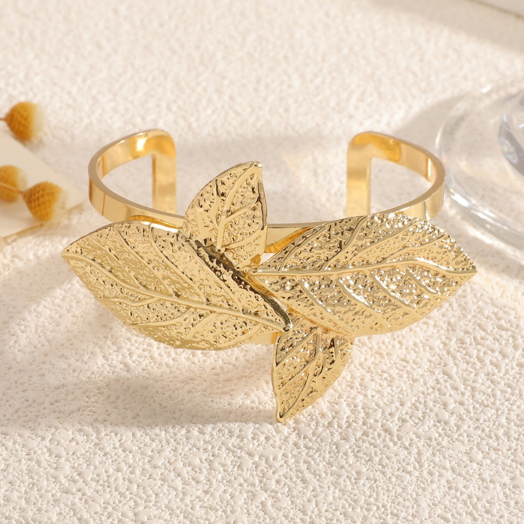 Ladies' bangle with artistic leaf design Fashion Glam