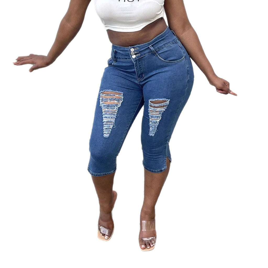 Women's high-waisted, three-quarter length stretch jeans with destroyed inserts and side seam slit Fashion Glam