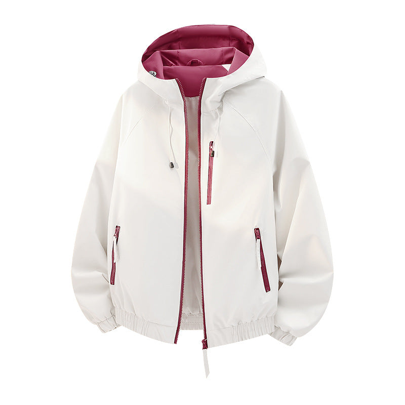Women's lightweight hooded shell jacket in urban look with contrasting lining, zippered pockets, and elastic hem Fashion Glam