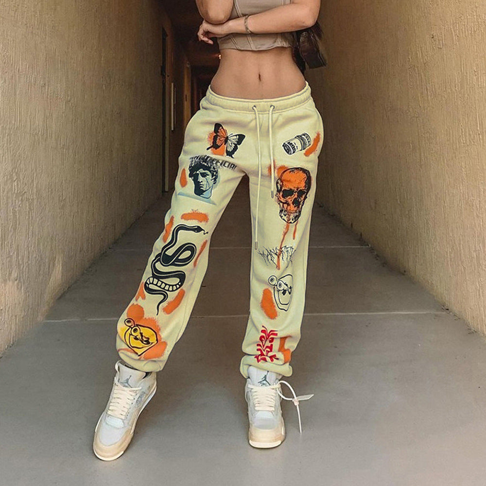Women's graphic joggers with a high waistband, drawstring, and streetwear prints Fashion Glam