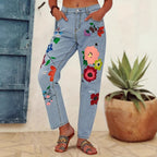 Ladies straight-cut jeans with colorful floral appliqués and light destruction details Fashion Glam