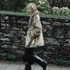 Women's faux fur coat in oversized cut with lapel collar, tie belt and pockets Fashion Glam